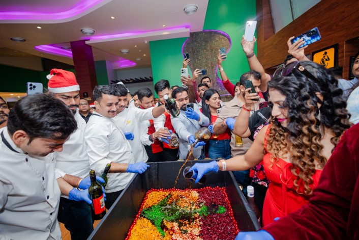 Guests join the festive cake mixing tradition
